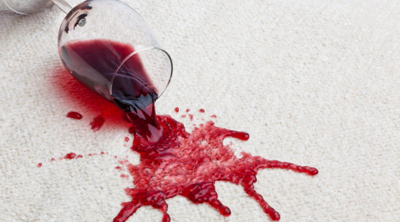 Glass of red wine spilt on carpet