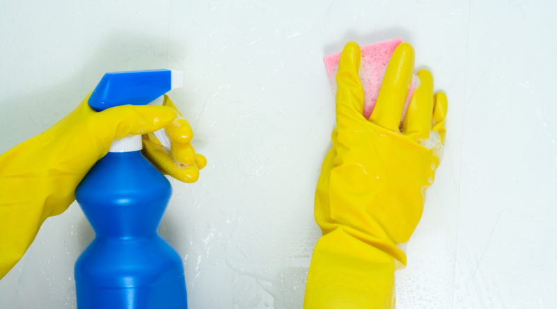 Cleaning with spray bottle and sponge