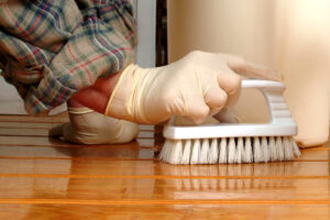 Scrubbing floor with brush